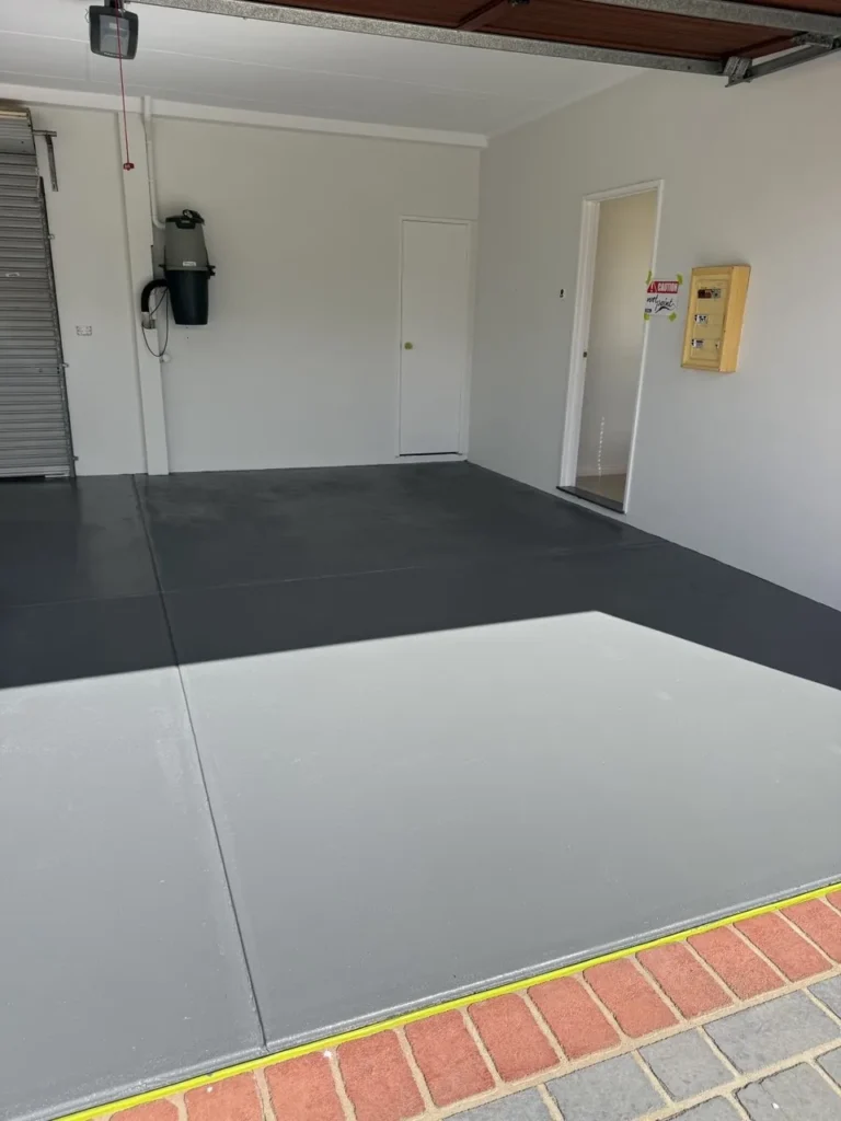 Finished two-tone grey painted concrete floor inside a Kardinya tenancy