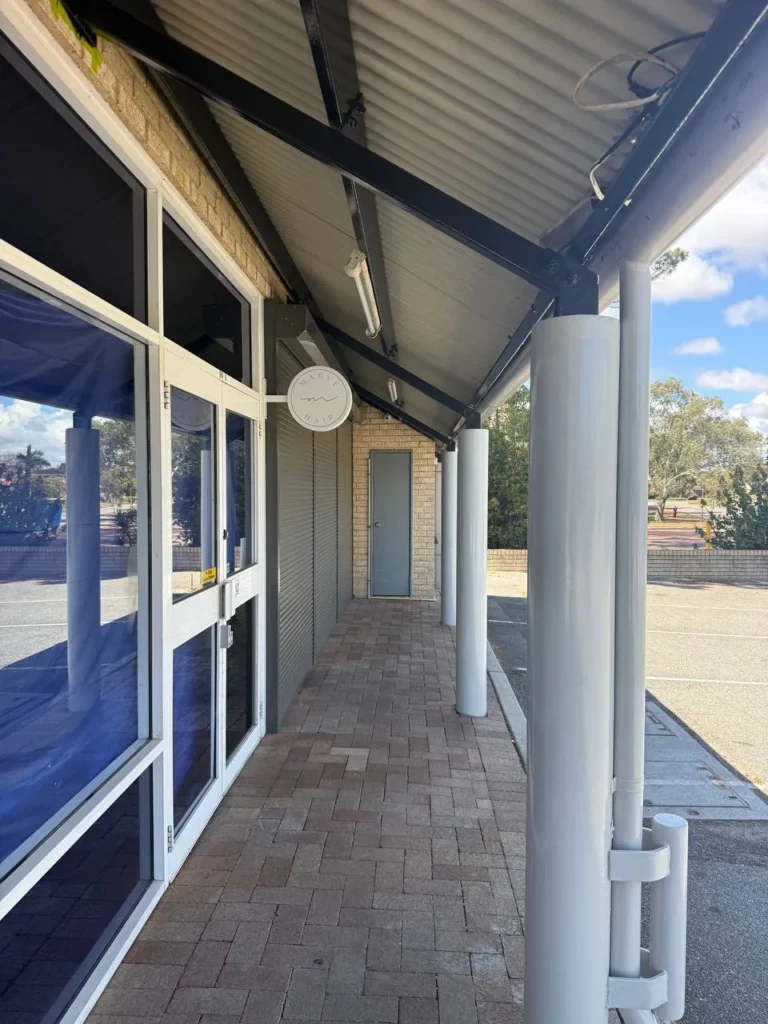 Shopfront verandah in Kardinya with freshly painted posts, beams and soffit